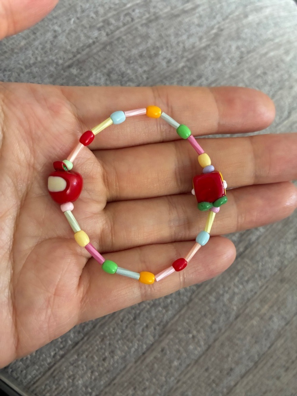 Children's Multicolor Beaded Bracelet with Red Apple & Backpack Charms - Picture 2 of 2